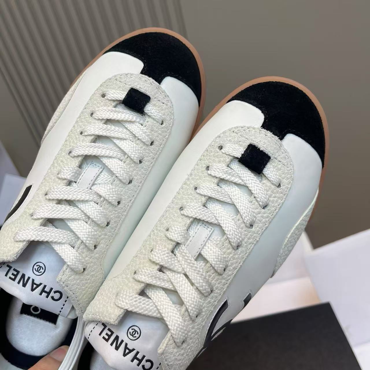 Chanel Women Retro De‑Training Sneakers White Leather Black Suede Toe Cap Gum Rubber Sole Lace‑Up Shoes