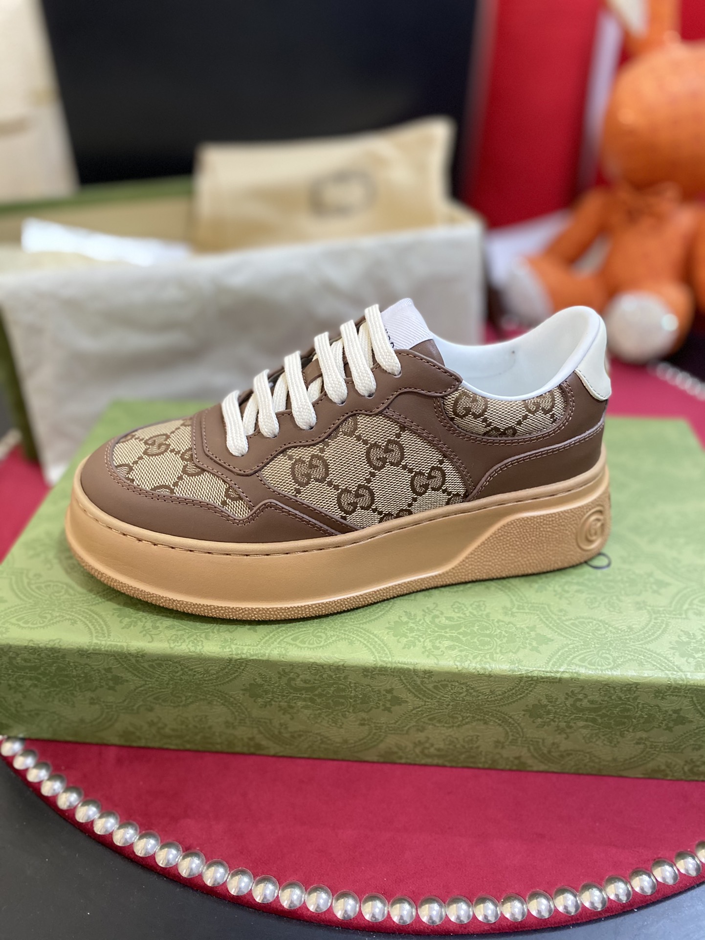 TOP GUCCI Double G Embossed Leather Rubber Platform Sneakers - Brown