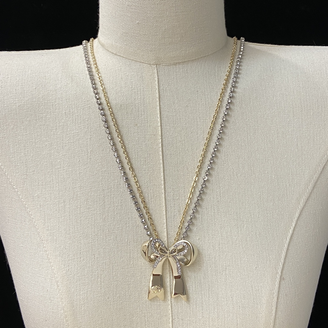 TOP CHANEL Long Bow Necklace - Gold and Silver