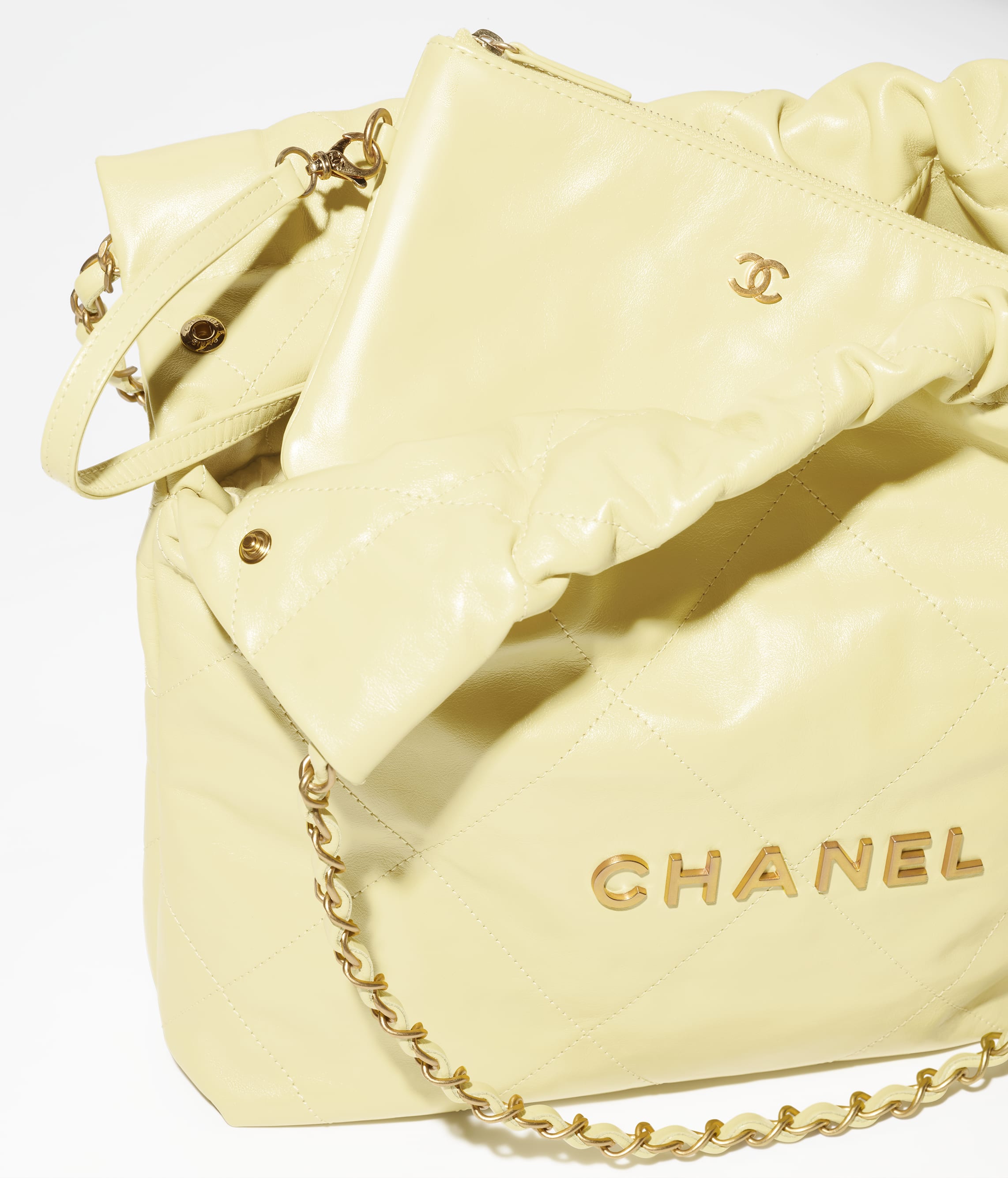 CHANEL 22 SMALL HANDBAG Shiny Calfskin & Gold-Tone Metal Light Yellow