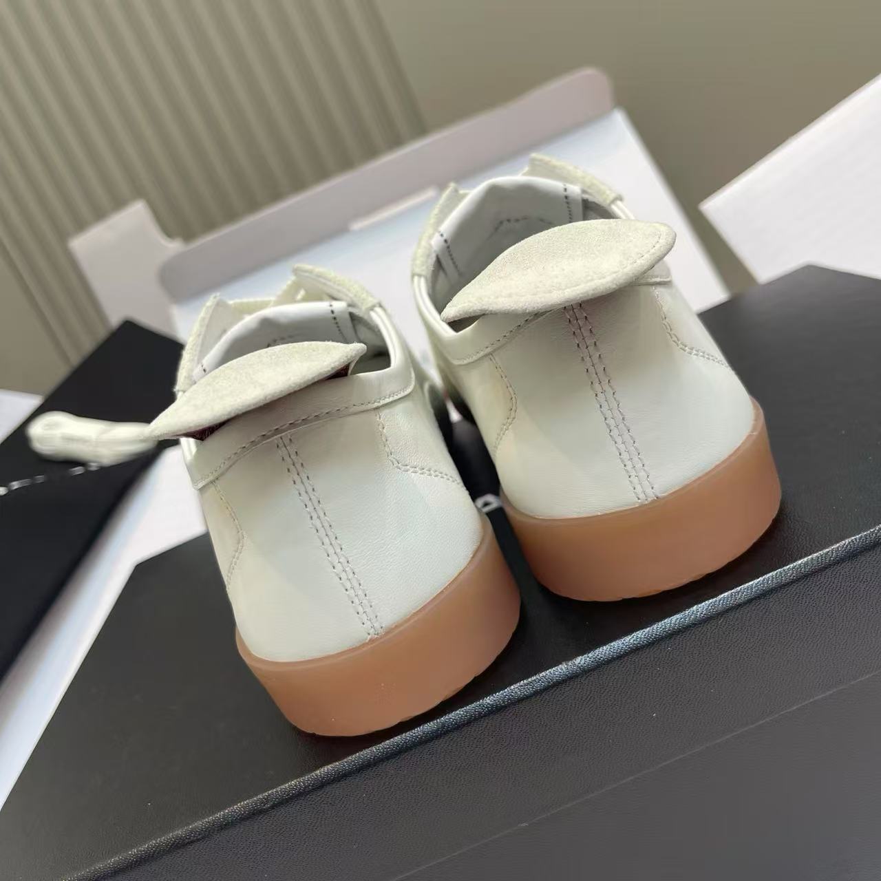 Chanel Women Retro De‑Training Sneakers White Leather Black Suede Toe Cap Gum Rubber Sole Lace‑Up Shoes