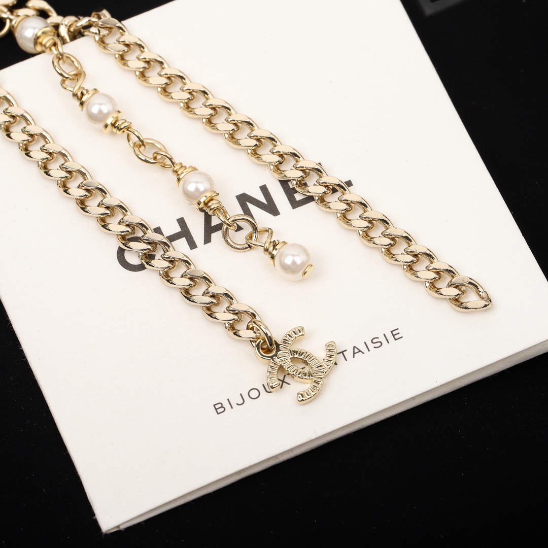 TOP CHANEL Black Oval Pearl Tassel Earrings