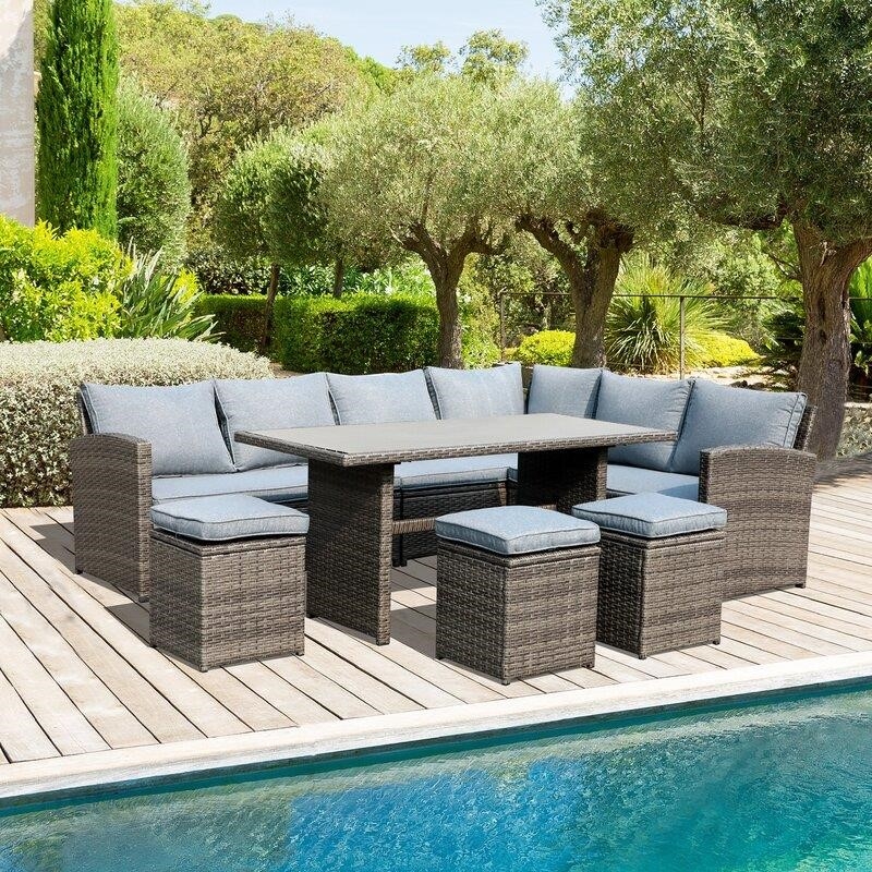 Binpal 7 Piece Rattan Sectional Seating Group with Cushions