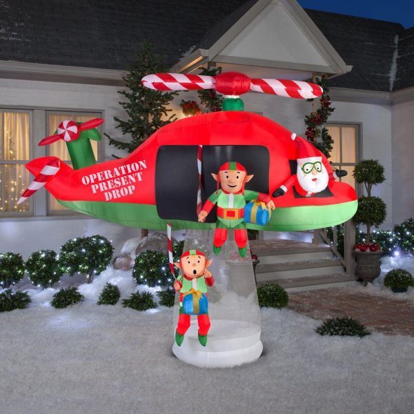 Christmas-animated inflatable santa and elves in an animated helicopter scene