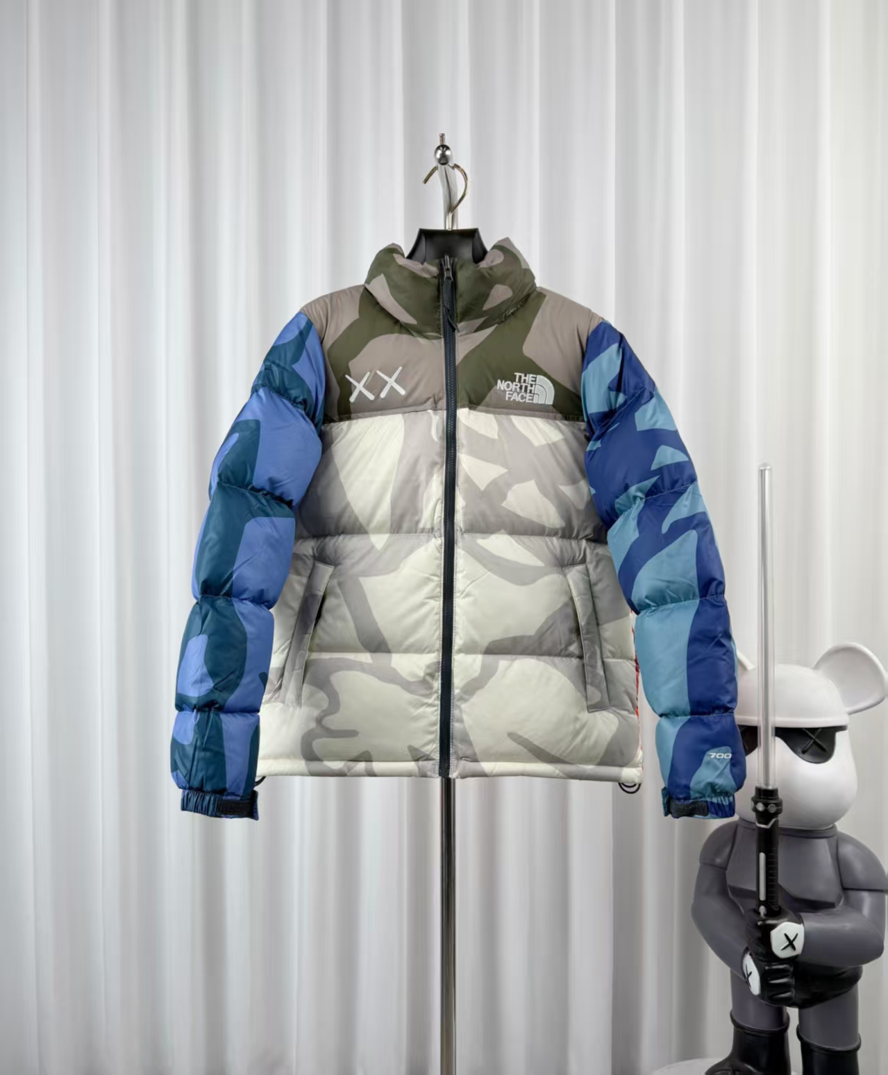 The North Face × KAWS Blue White Camouflage Down Jacket – Artistic Collaboration