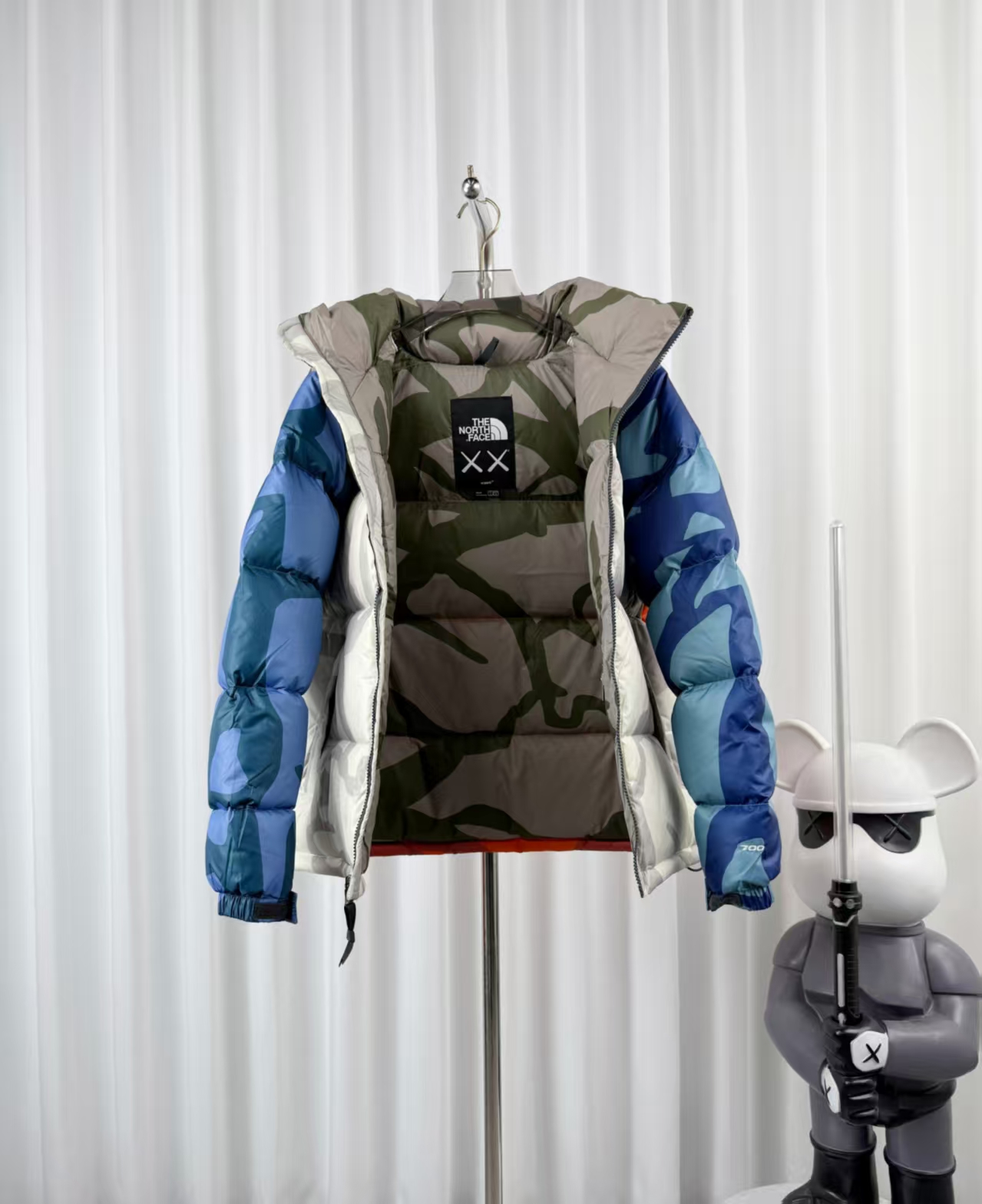 The North Face × KAWS Blue White Camouflage Down Jacket – Artistic Collaboration