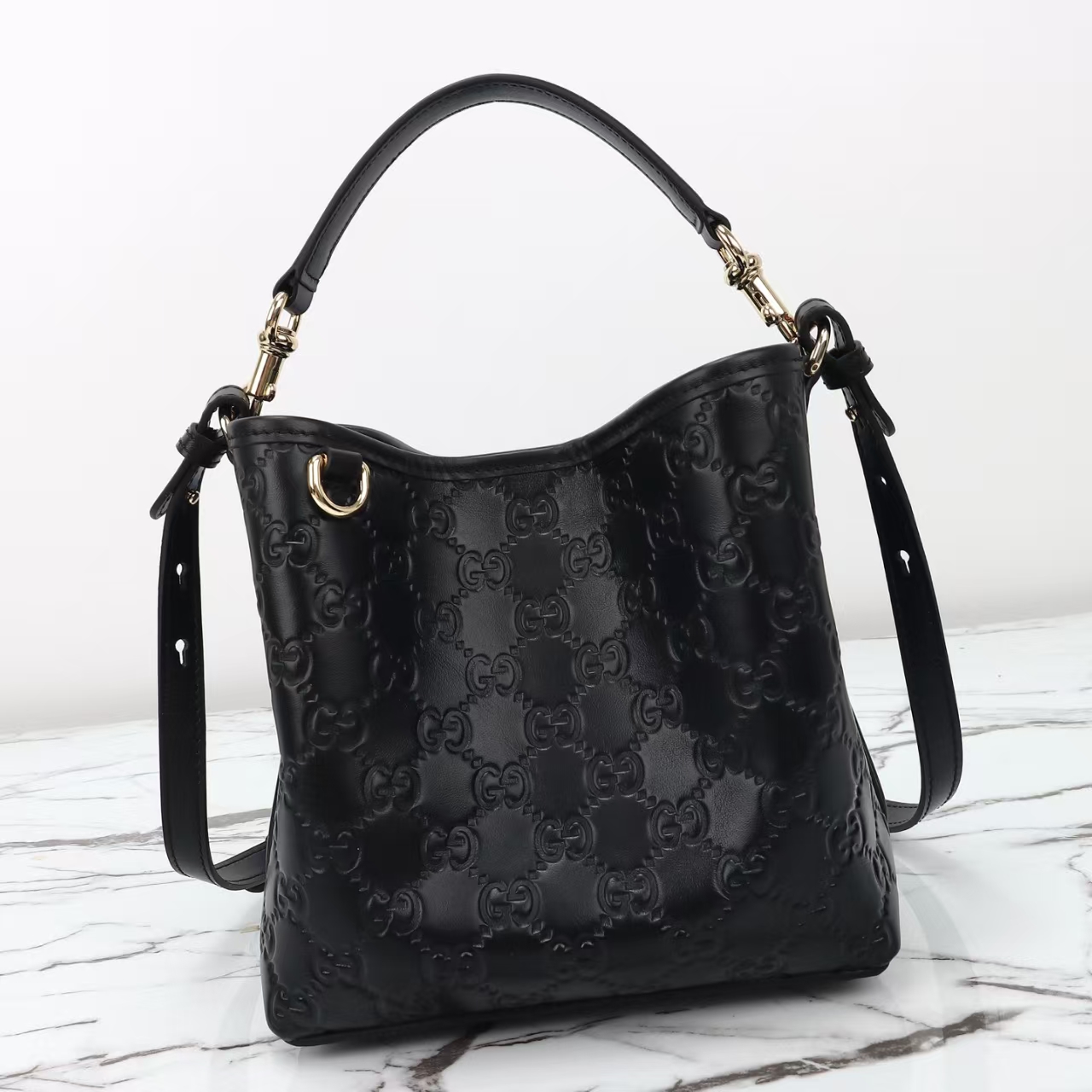 Gucci GG Emblem Small Bucket Bag in Black | GG Embossed Calfskin Leather with Adjustable Strap