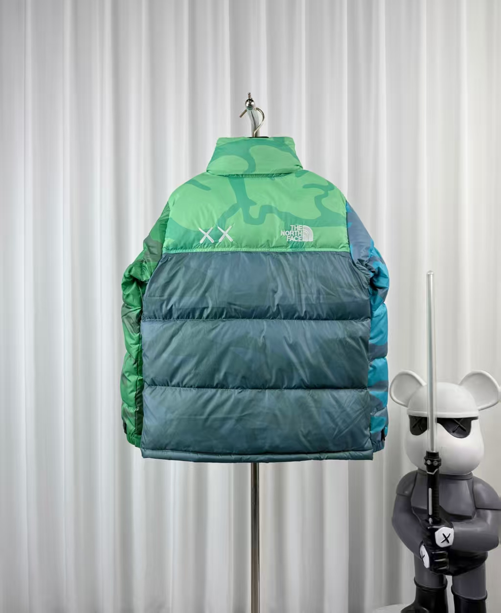 The North Face × KAWS Light Yellow-Green Down Jacket – Artistic Collaboration
