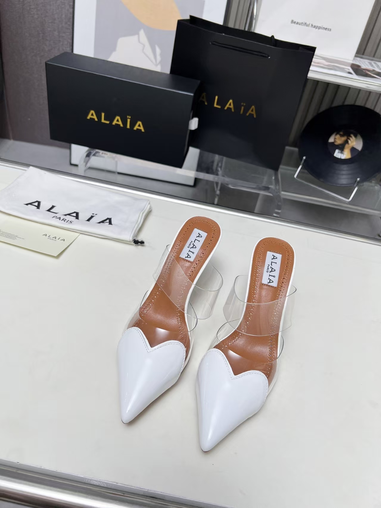 Alaïa Clear 9cm Stiletto Heeled Sandal in White | Transparent Pointed-Toe Pump