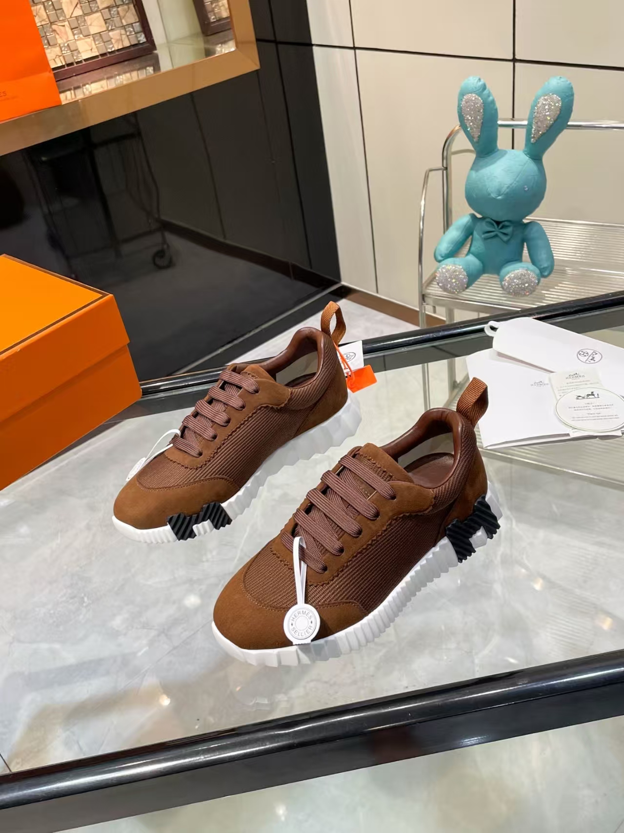 Hermès Sellier Knit Leisure Sneaker in White & Brown | Equestrian-Inspired Luxury Sport Shoe