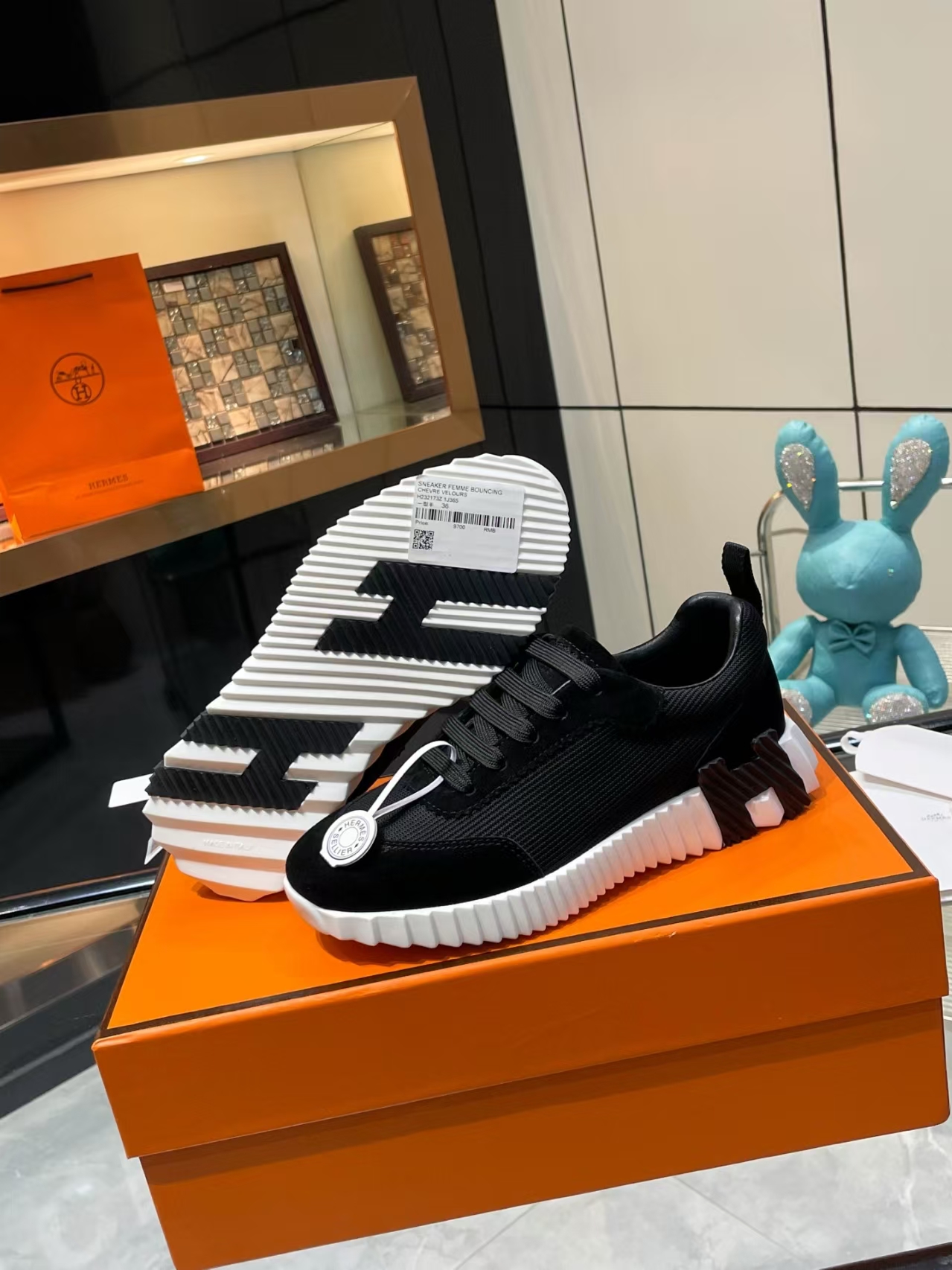 Hermès Sellier Knit Leisure Sneaker in White & Black | Equestrian-Inspired Luxury Sport Shoe