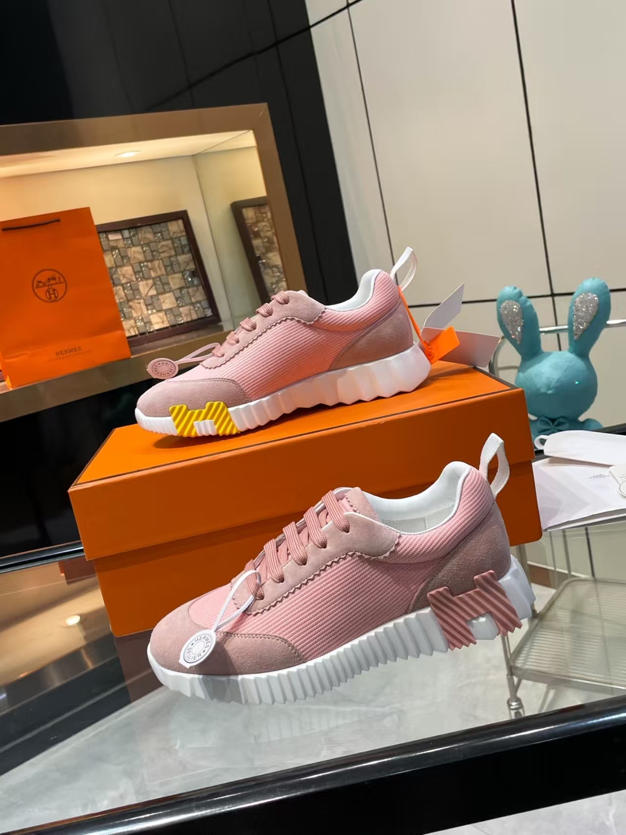 Hermès Sellier Knit Leisure Sneaker in White & Blush Pink | Equestrian-Inspired Luxury Sport Shoe