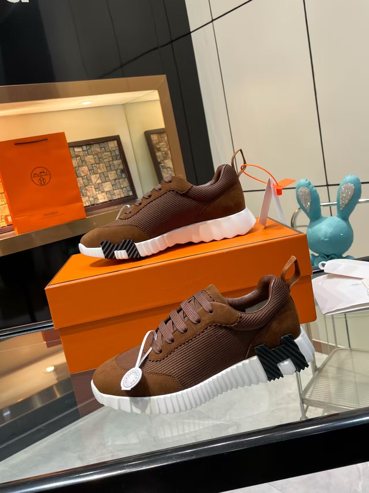 Hermès Sellier Knit Leisure Sneaker in White & Brown | Equestrian-Inspired Luxury Sport Shoe