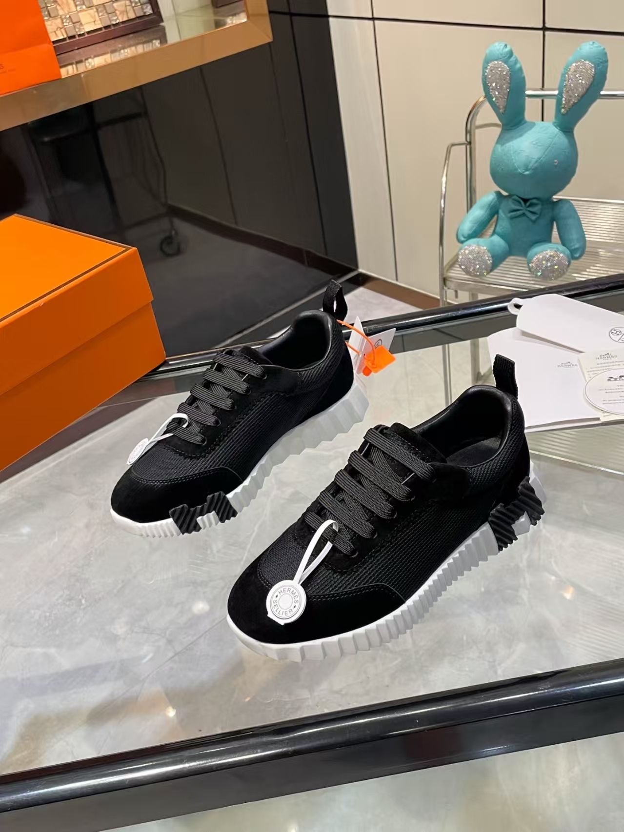 Hermès Sellier Knit Leisure Sneaker in White & Black | Equestrian-Inspired Luxury Sport Shoe