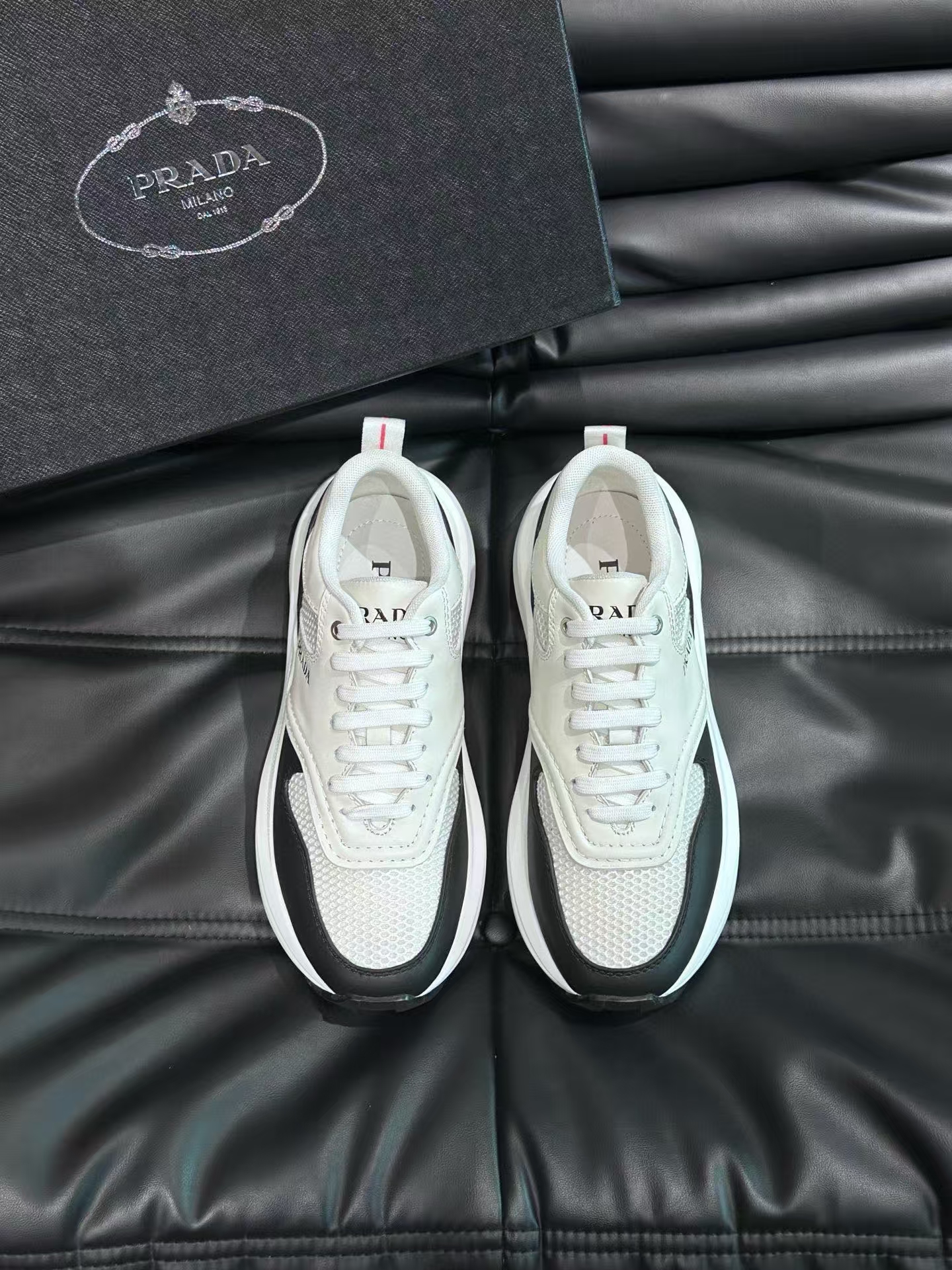 Prada Men's Black & White Calfskin & Mesh Casual Sneaker | Perforated Leather Athletic Shoe