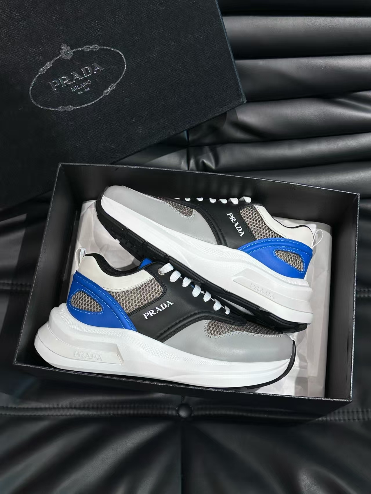 Prada Men's Grey-White Calfskin & Mesh Casual Sneaker | Perforated Leather Athletic Shoe