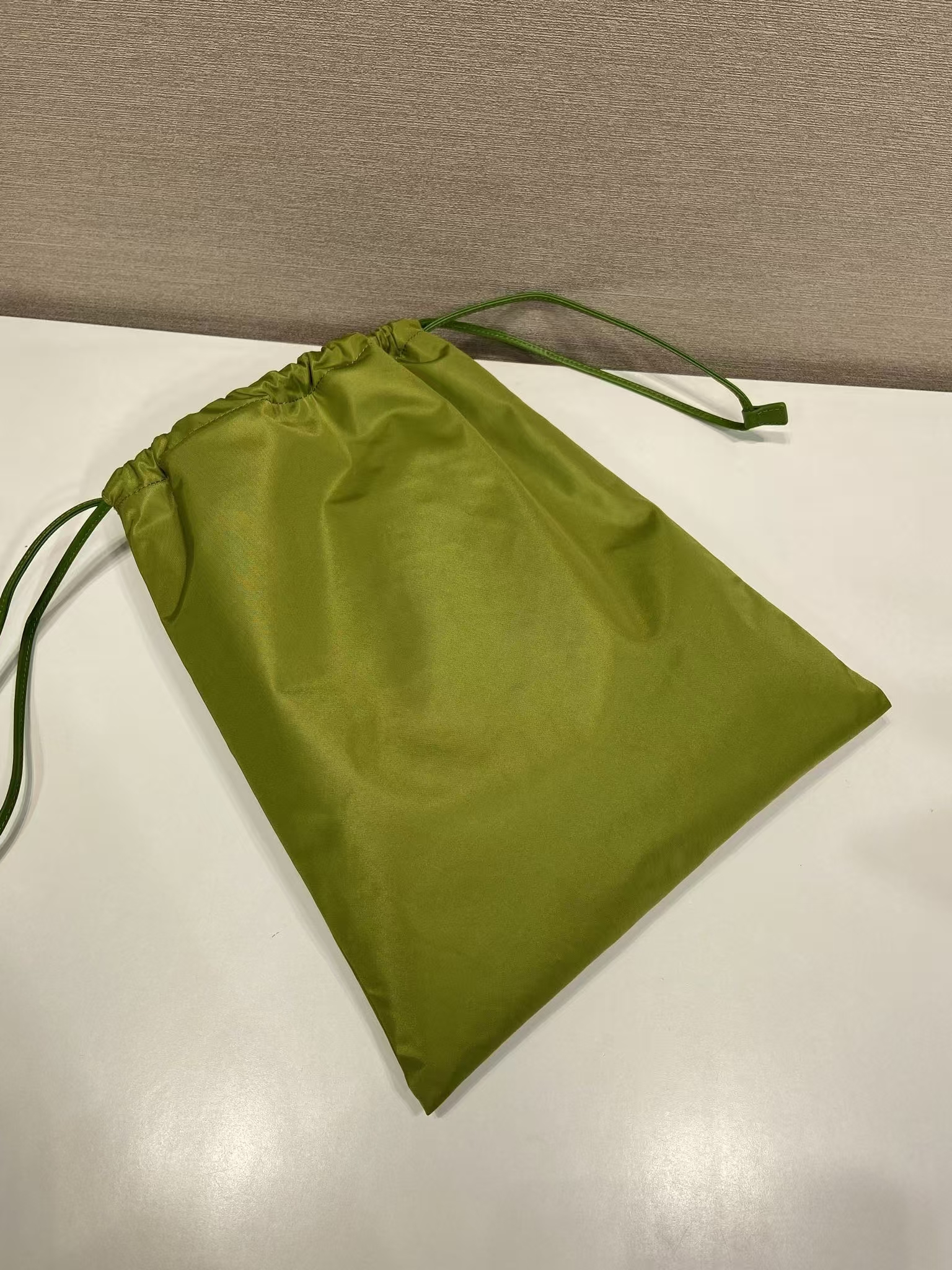 Prada Ivy Green Recycled Nylon Drawstring Pouch | Nature-Inspired Hue & Leather Trim