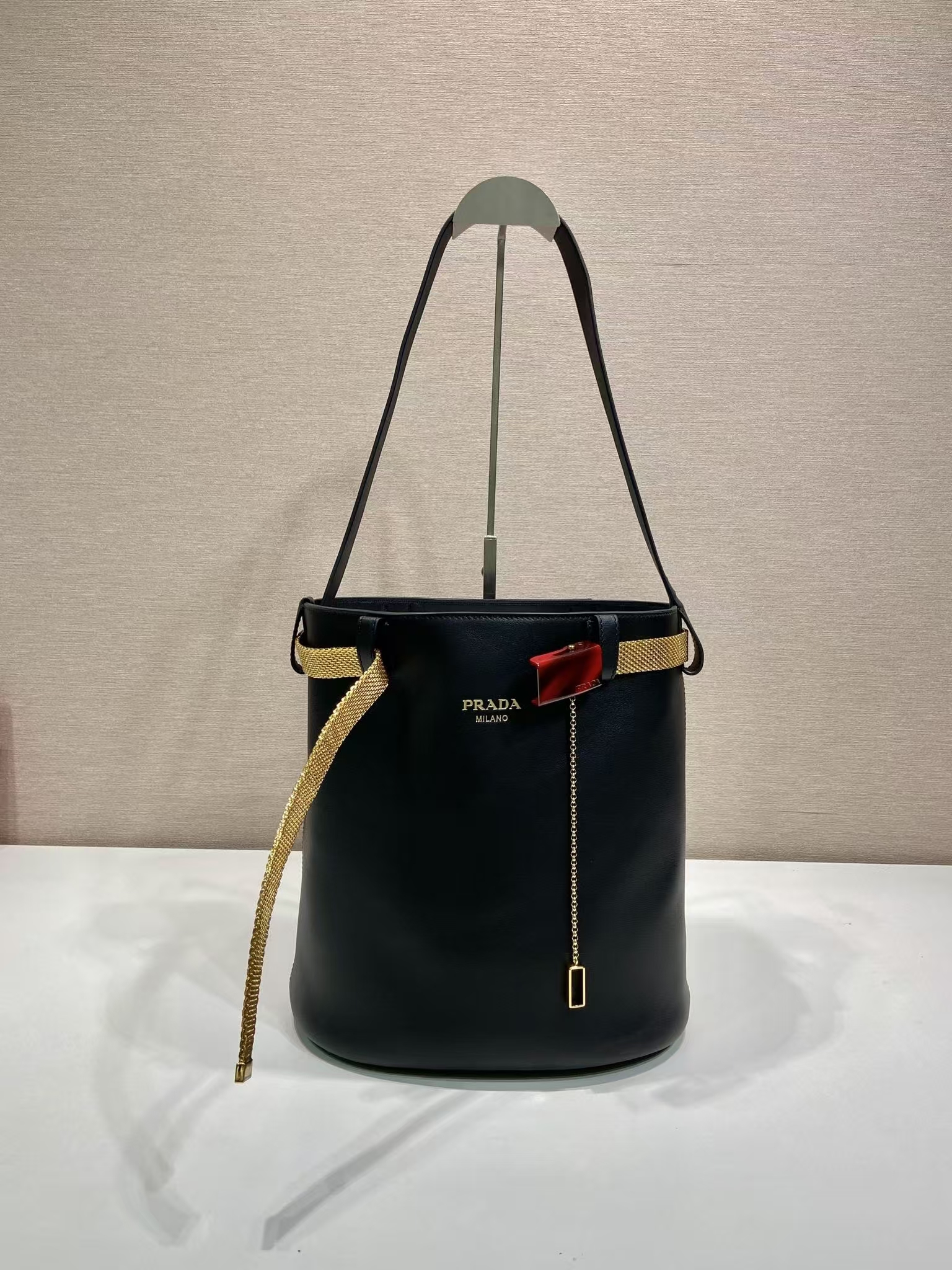 Prada Black Buckle Leather Bucket Bag | Metallic Mesh Strap & Tortoiseshell Buckle