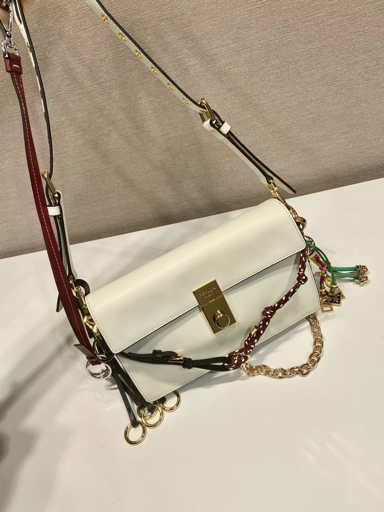 Prada White Small Soft Sound Leather Shoulder Bag | Detachable Charms & Crisp Minimalist Design