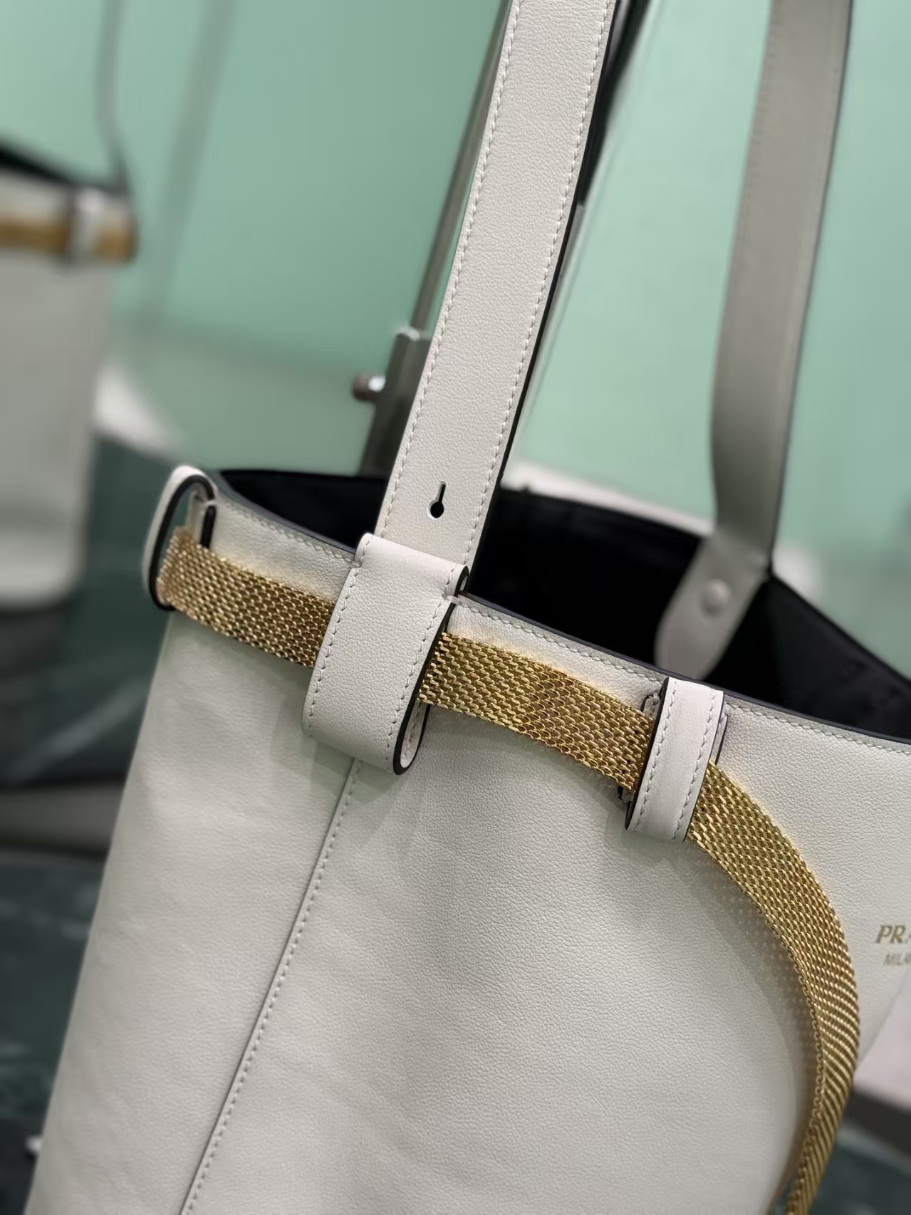 Prada White/Black Buckle Leather Bucket Bag | Two-Tone Contrast & Metallic Mesh Strap