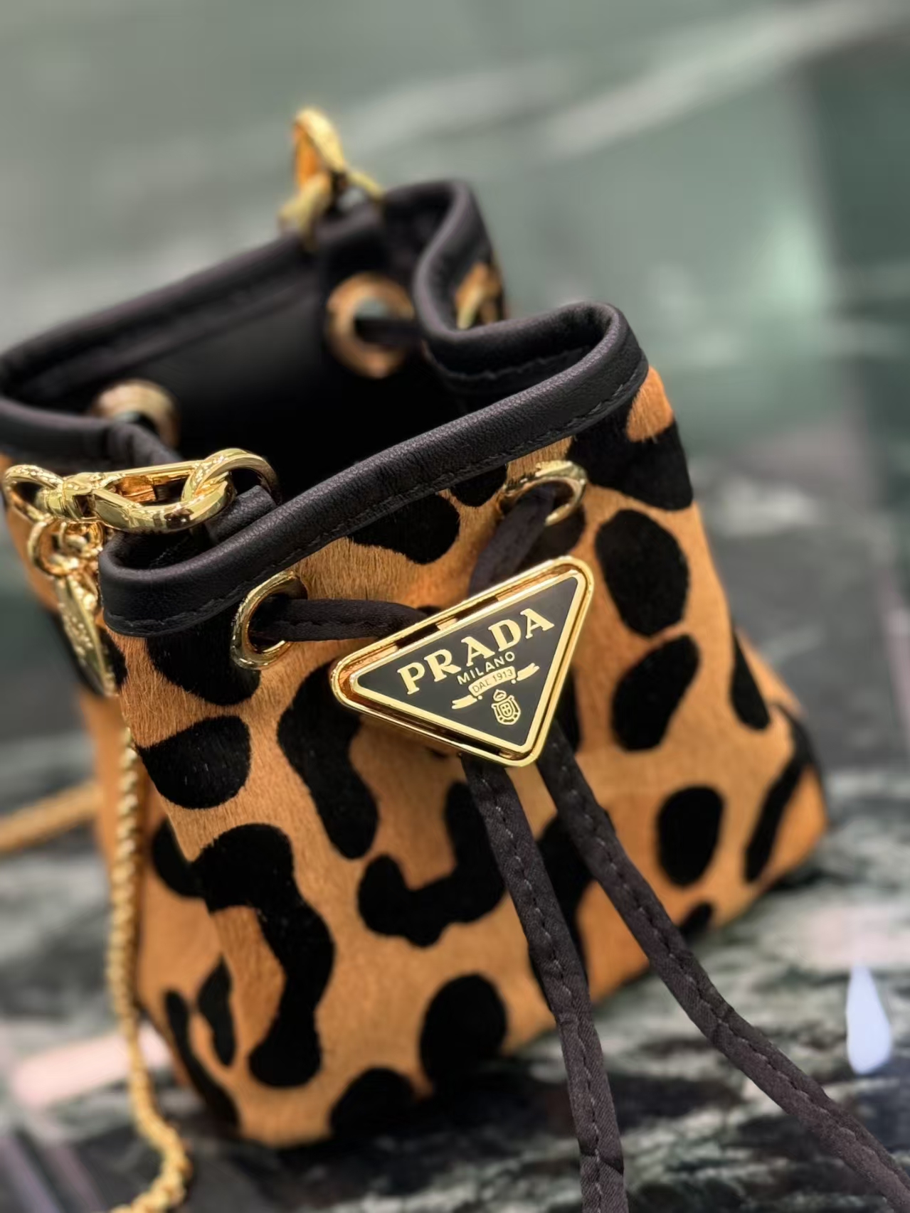Prada Honey Printed Leather Mini Pouch | Drawstring Closure & Detachable Chain