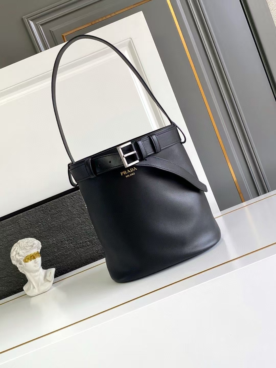 Prada Black Buckle Leather Bucket Bag | Strap Detail & Structured Silhouette