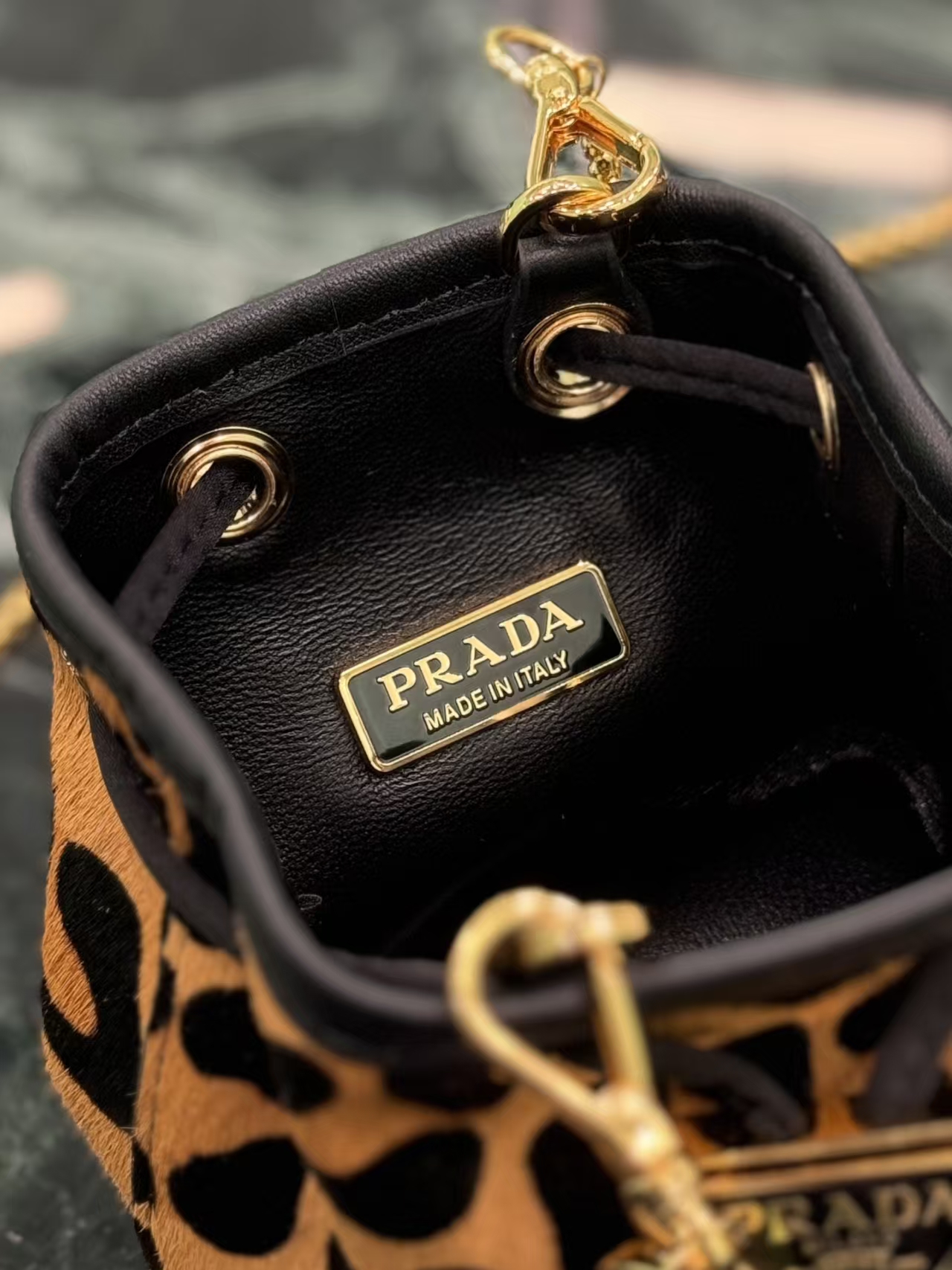 Prada Honey Printed Leather Mini Pouch | Drawstring Closure & Detachable Chain