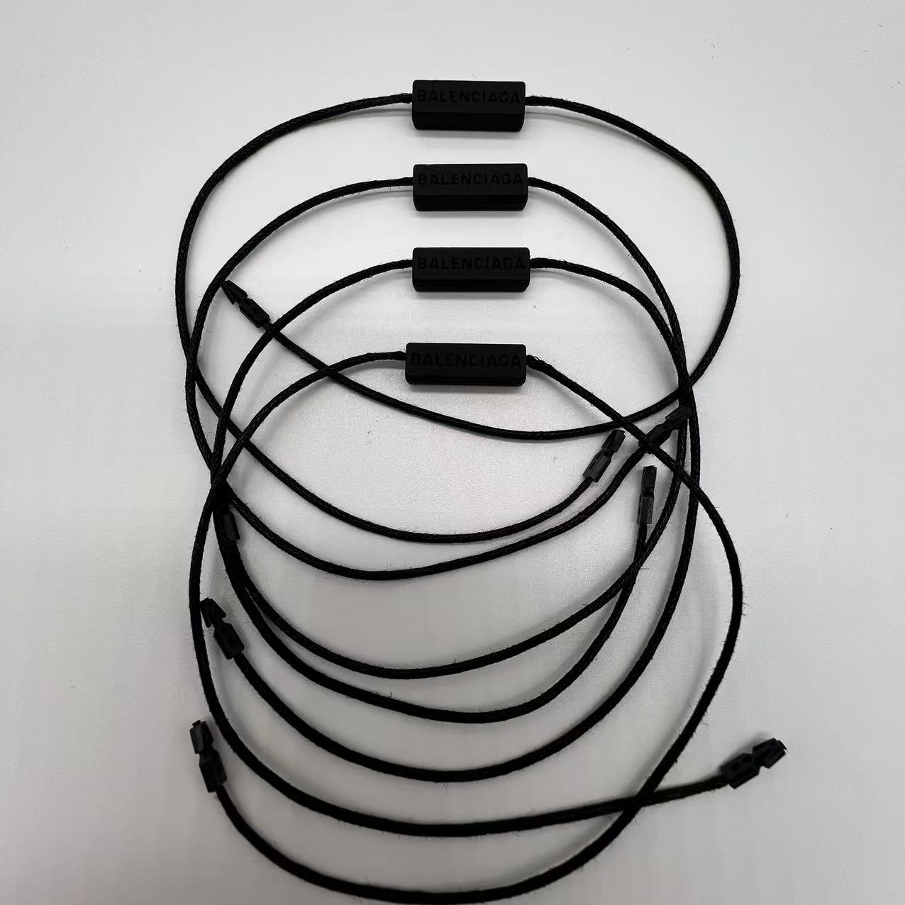 Wholesale Garment String Lock Seal Tags | Branded Secure Hang Tag Locks for Apparel Accessories