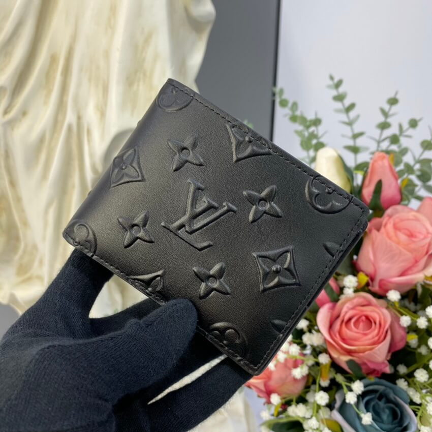 Louis Vuitton Monogram Seal Cowhide Leather Slender Wallet M80520