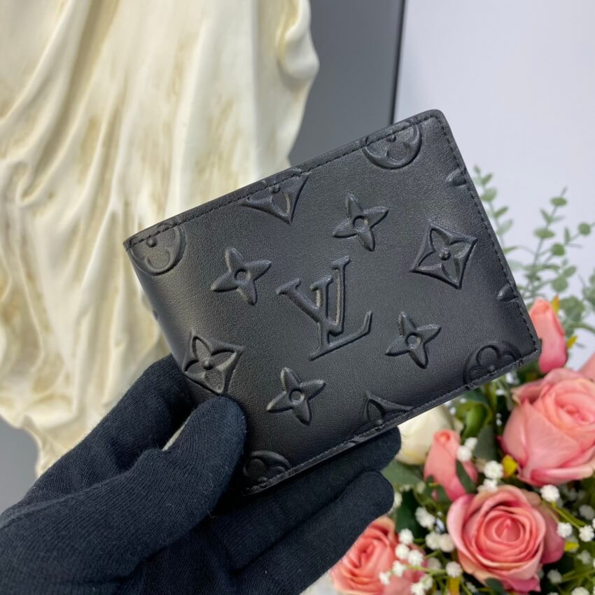 Louis Vuitton Monogram Seal Cowhide Leather Slender Wallet M80520