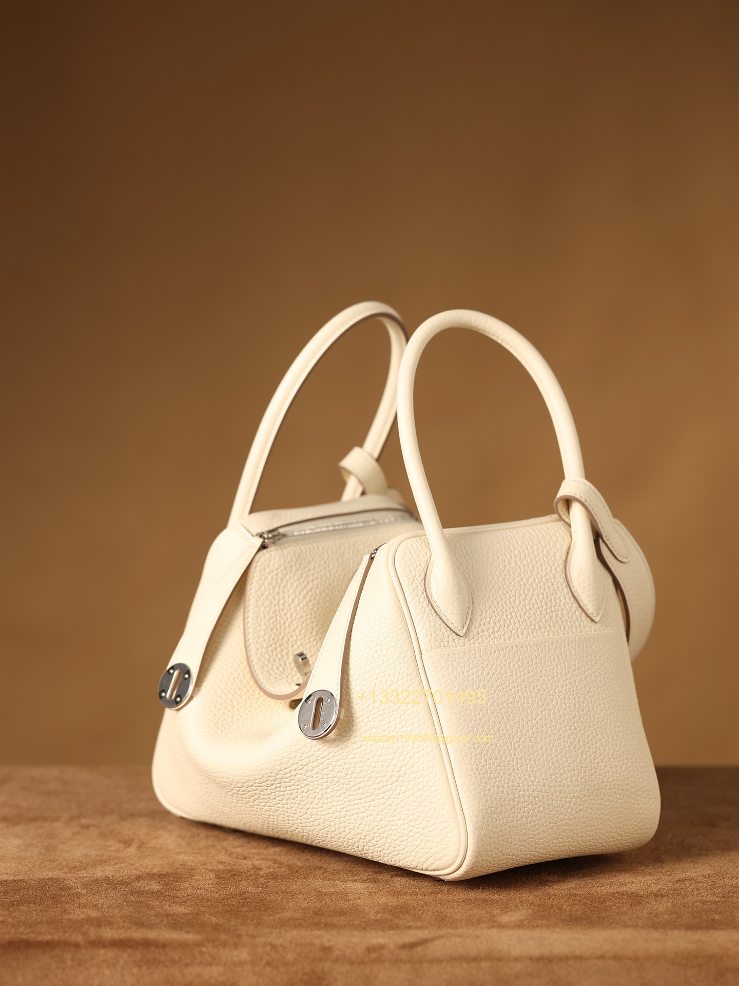 Hermès Lindy in Cream White, crafted with Hermès' exclusive Clemence leather, purely handcrafted, high-end customization edition.