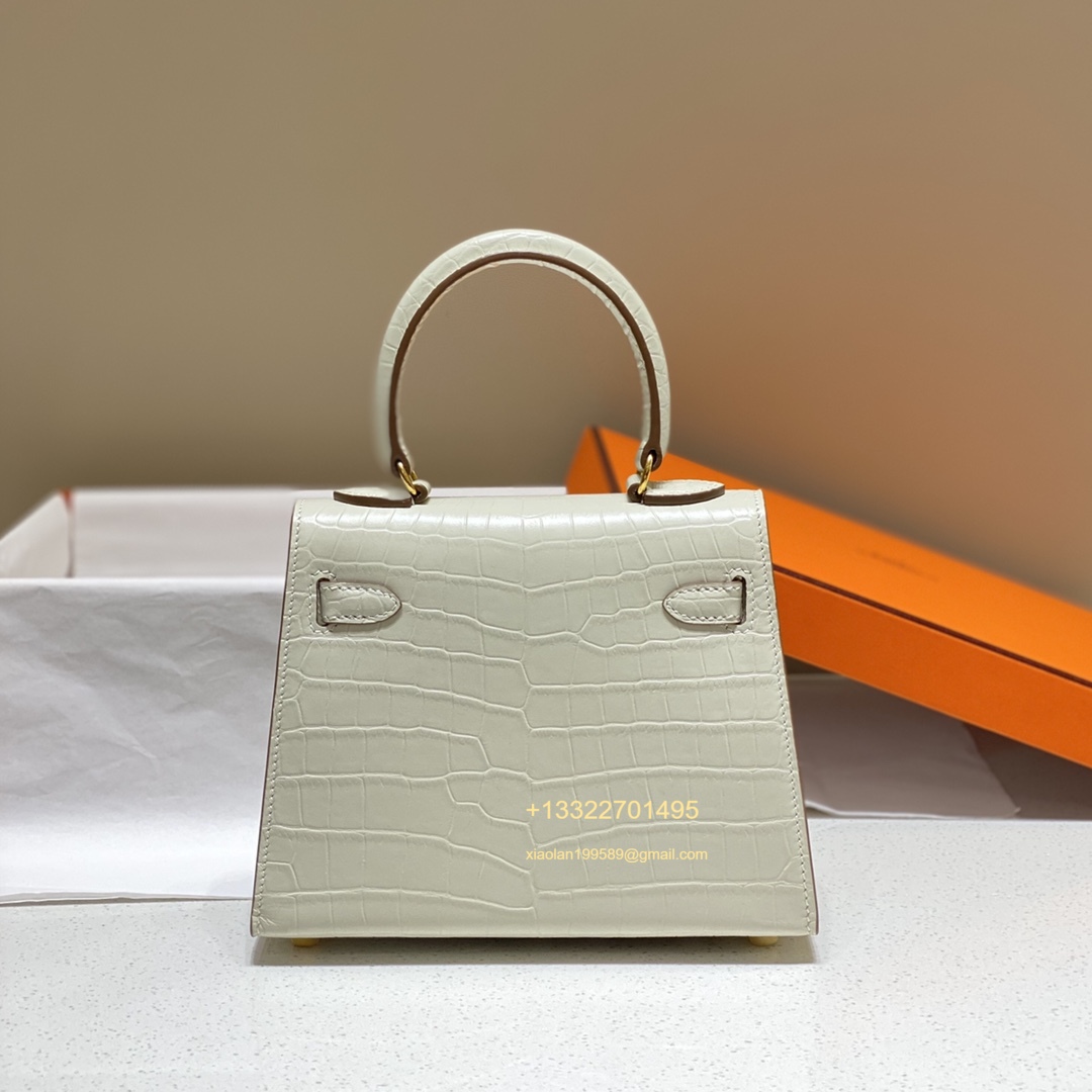 Hermès Mini Kelly 20cm in Milky White Purely Handcrafted with Waxed Thread Stitching, High-End Customization  This is a discontinued and rare piece, but we have it in stock. Highly coveted and rarely seen on the market, it is a favorite among Hermès