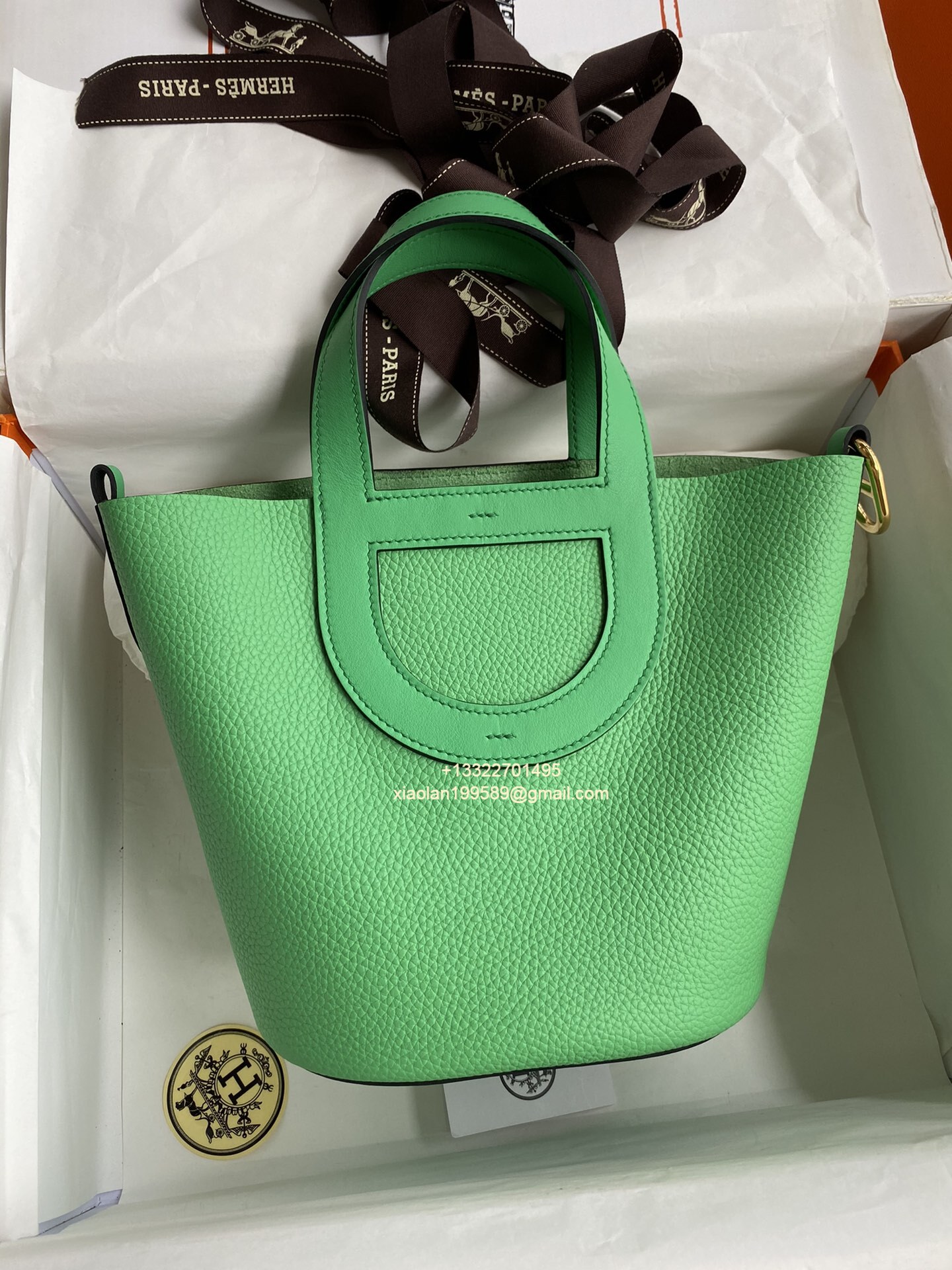 ChatGPT said: Hermès In-The-Loop 18/23 Bag in Taurillon Clemence (TC) and Swift Leather, Hand-stitched with Beeswax Thread. Color: Vert Comics.