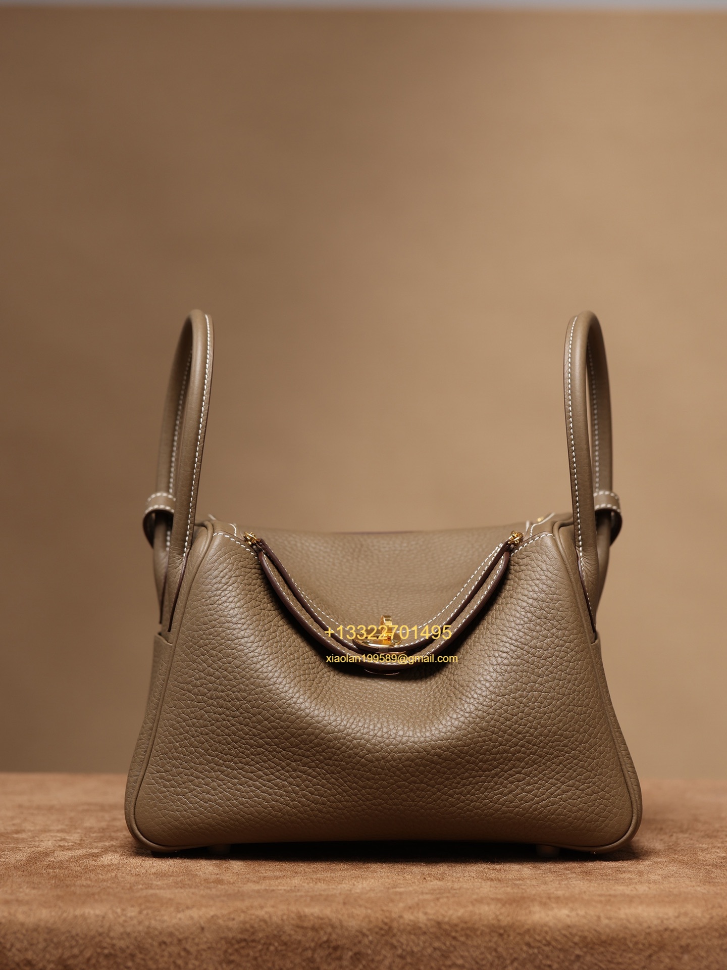Hermès Lindy in Etoupe Grey, crafted with Hermès' exclusive Clemence leather, purely handcrafted, high-end customization edition.
