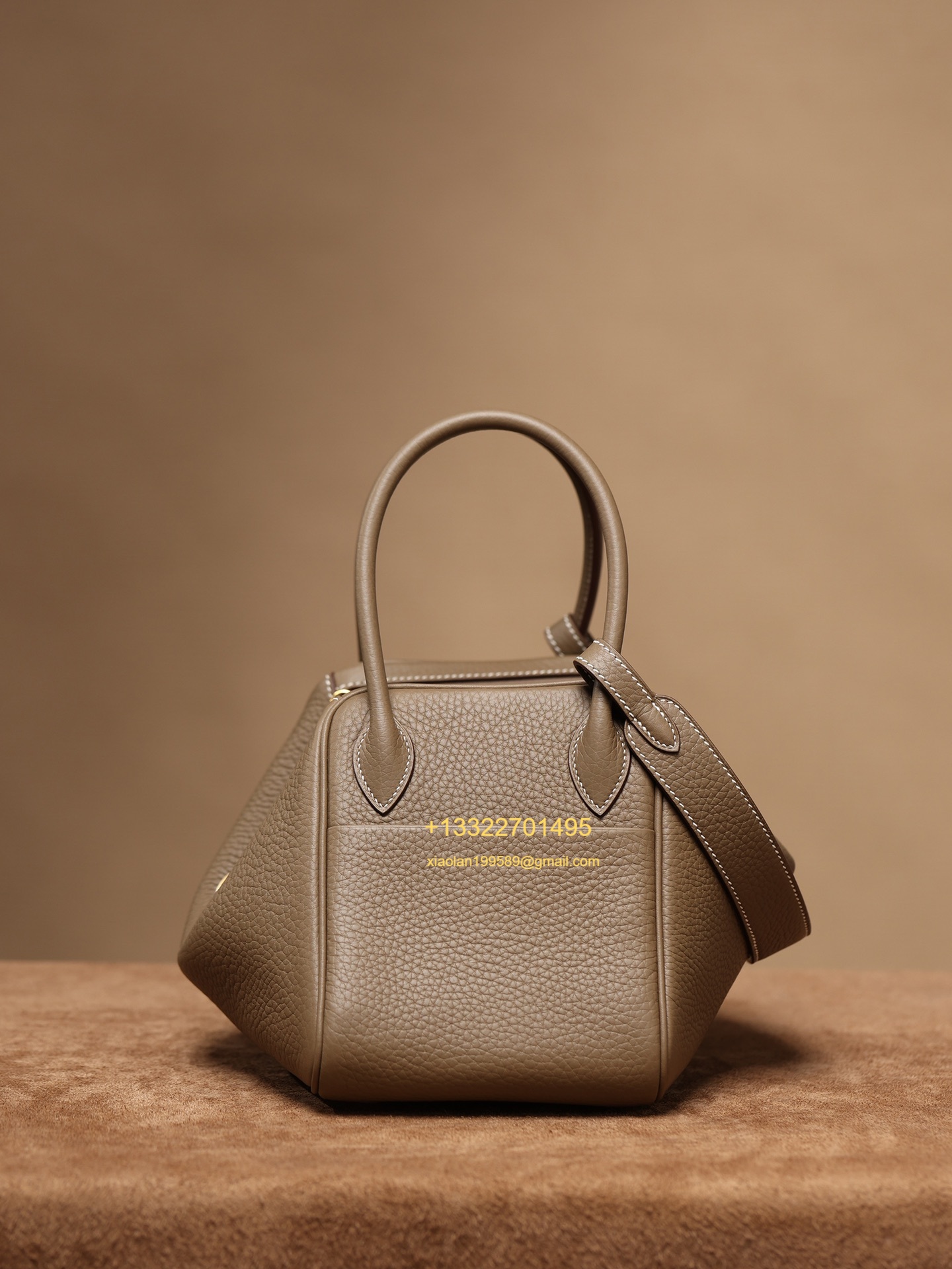 Hermès Lindy in Etoupe Grey, crafted with Hermès' exclusive Clemence leather, purely handcrafted, high-end customization edition.