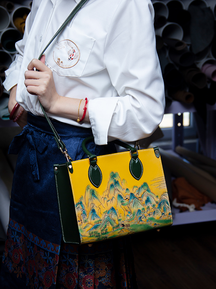 Leather Carved Tote Bag, Vintage Genuine Leather Women's Handbag, Shoulder and Crossbody Bag, featuring a traditional Chinese landscape design and new trendy style.
